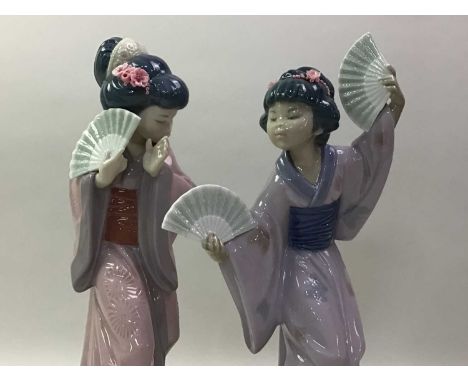 TWO LLADRO FIGURES OF GEISHA  ALONG WITH A NAO FIGURE the Nao figure of a girl playing a musical instrumenttallest 30cm high