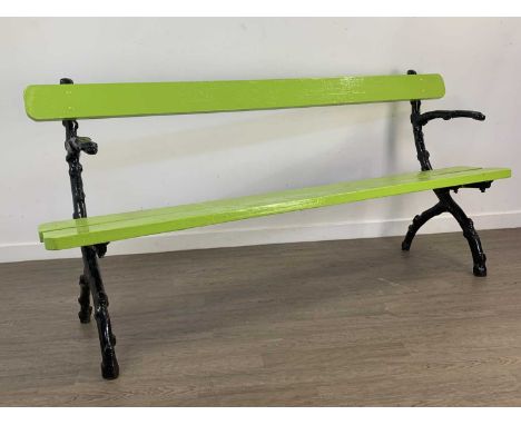 GARDEN BENCH with naturalistic branch cast iron ends and wooden slats painted in vibrant green183cm wide