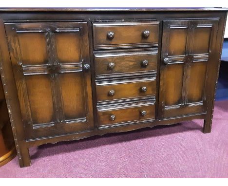 ERCOL DINING SUITE comprising sideboard, dining table and eight chairs Qty: 10