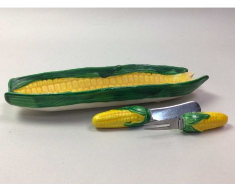VINTAGE CORN ON THE COB CERAMIC SET, comprising sis dishes and a set of knifes and holders with corn handleseach dish 24cm lo
