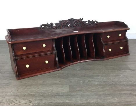 STAINED WOOD DESK TOP STATIONARY CABINET with pigeonholes flanked by drawers with ceramic handles107cm high