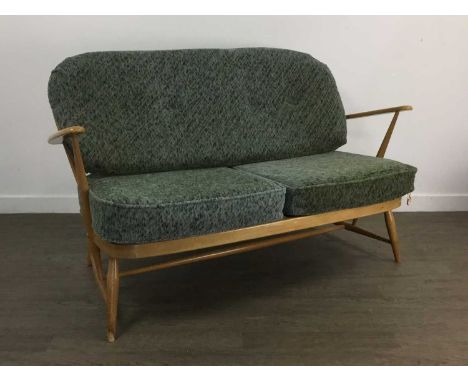 ERCOL BEECH AND ELM SUITE, comprising a two seater settee and pair of rocking chairs, with green upholstered cushionstwo seat