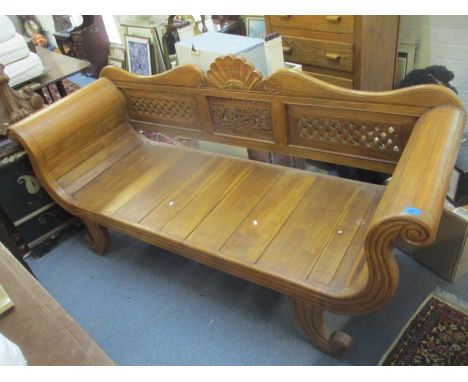 A teak scroll end sofa having a pierced floral and lattice decorated back rest, 99h x 203w.Location:Stairs 