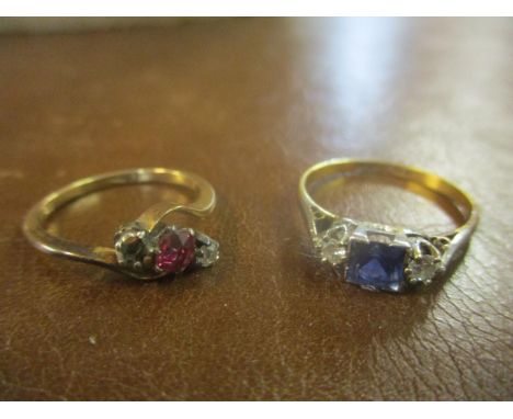 An 18ct and platinum, sapphire and diamond ring, along with an 18ct gold ring set with diamonds and a ruby, (one stone defici