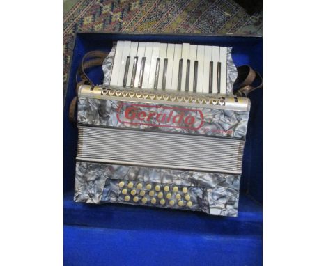 A cased Geraldo piano accordion Location: RAM 