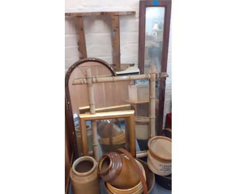 A quantity of vintage aluminium cooking pots, stoneware pots and bowls, vintage mirrors and a pine wall shelf and picture fra