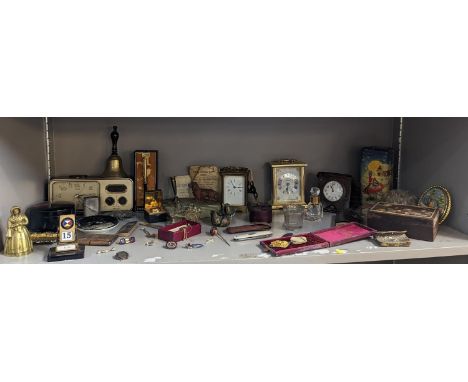 A mixed lot to include carriage clocks, a battery Lorus clock radio, mixed enamel pin badges and other hat pin, brooches, a c