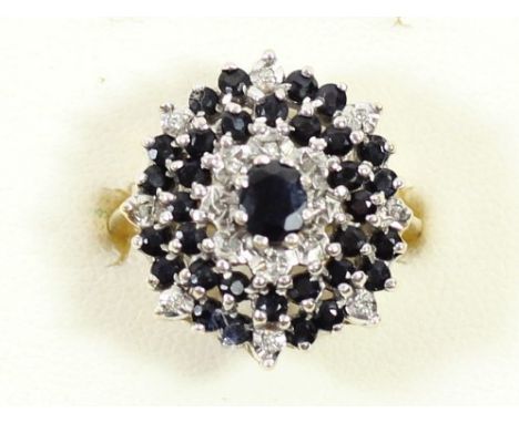 A 9ct gold sapphire and diamond chip cluster ring, N 1/2, 5.7gm