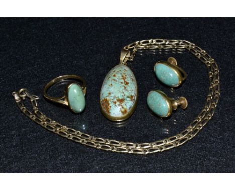 A Jade green stone four piece parure, comprising pendant necklace, unmarked yellow metal mounts, suspended from a 9ct gold ne