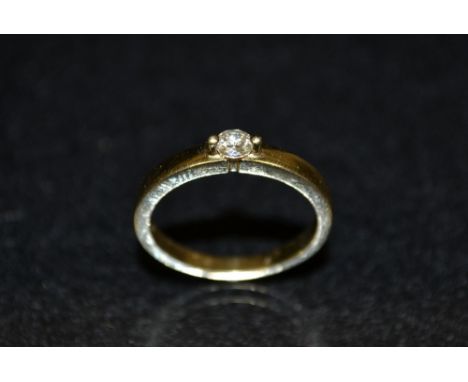 A diamond solitaire ring, round brilliant cut diamond twin pillar crown, total diamond weight approx 0.17ct, 18ct gold shank,