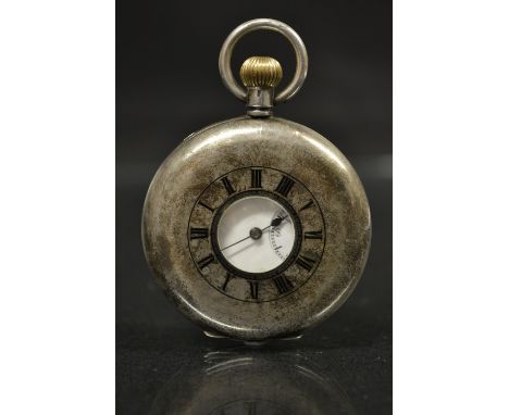 A 935 continental silver half hunter pocket watch, black outer dial, white dial, Roman numaerals, minute track, subsidiary se