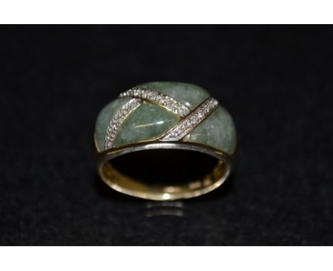 A Jade green stone, diamond  and white sapphire dress ring, irregular quartered crest divided by diamond and white sapphire a