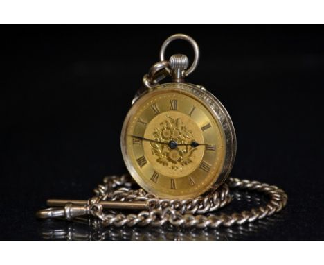 A 12ct gold open face pocket watch, gilt floral dial, raised Roman numerals, minute track, blued hands, button wind movement,