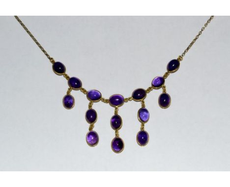 A 9ct gold mounted and amethyst fringe necklace, five droplet fringe individually inset with fifteen oval amethyst cabochons,
