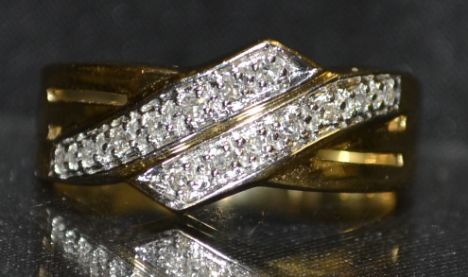 A diamond engagement ring, two interconnected rows of seven round cut diamonds, white gold set, 14ct gold shank, size O, 4.1g