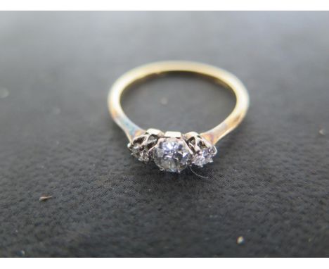 An 18ct Yellow Gold Three Stone Diamond Ring, the largest diamond approx 0.4ct in size, ring size P, approx 1.9 grams - light