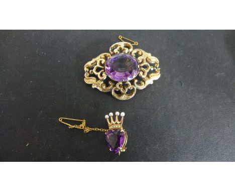 An amethyst and pearl 9ct yellow gold brooch and a large oval cut amethyst and gilt metal brooch
