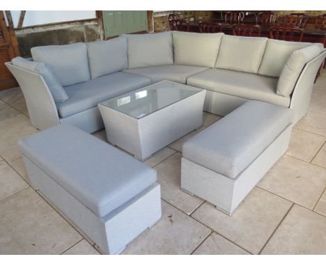 A Bramblecrest all weather garden corner sofa with a coffee table and two stools 