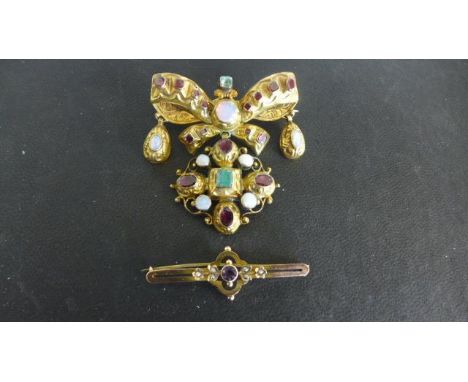 A gilt metal bow brooch with various stones, including moonstone and garnets and a 9ct yellow gold bar brooch, amethyst to ce