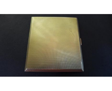 A 9ct yellow gold cigarette case, Birmingham 1937, maker WTT & Co with presentation inscription inside, total weight approx. 