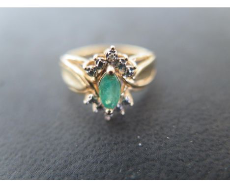 A 14ct yellow gold, marquise cut emerald and diamond ring, size P-Q, approx 4.2 grams - some light surface scratches and usag