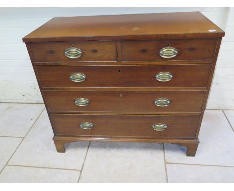An early 19th Century Mahogany Chest of Drawers with two short over three long drawers on bracket feet - sound condition and 