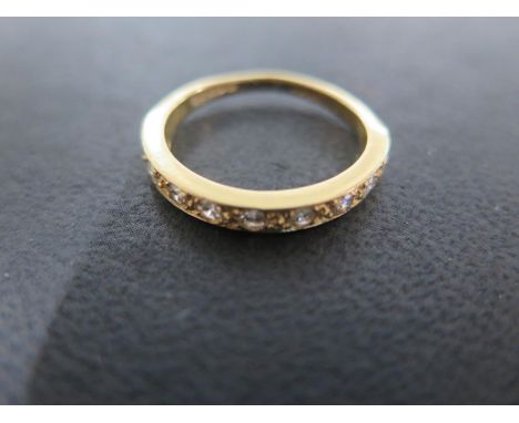 An 18ct Gold Modern Diamond Half Eternity Ring, 9 stones, round brilliant, Colour G/H, Clarity SI1/SI2 (assessed), dimensions