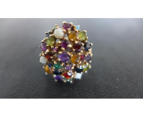 A 9ct yellow gold multi-gem cluster ring, size N, approx 6 grams - light usage wear 