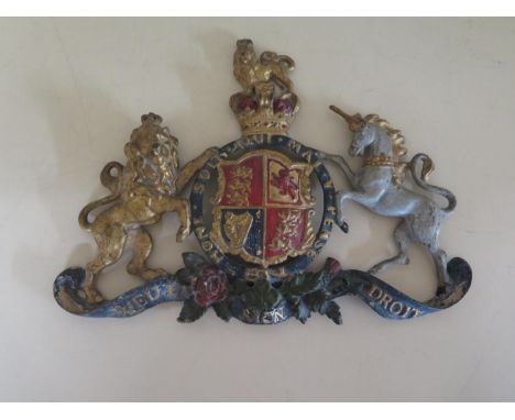 A cold painted bronze Royal Warrant - 21cm x 39cm - paintwork appears original - some general wear 