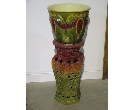 A ceramic jardinere on a stand - 105cm tall x 43cm diameter - chips and crack to jardinere and chips to stand 