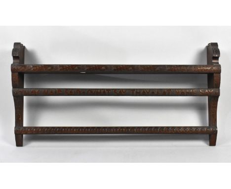 A Carved Wooden Wall Hanging Shelf Unit Decorated with Scottish Thistles and Inscribed "Thay Haif Said Quhat Say Thay Lat Yam