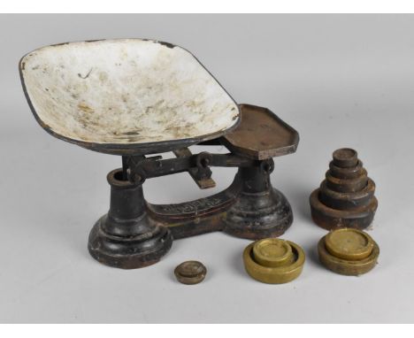 A Pan Scale with Cast Iron Base and Weights 