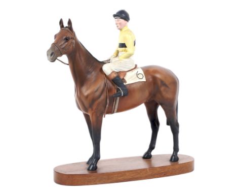 A large Beswick ceramic figure depcting a racehorse 'Arkel', with Pat Taaffe up, mounted on wooden base, 31cm high