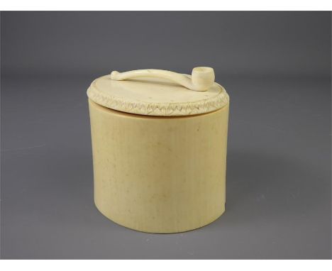 A 19th Century Ivory Cylindrical Tobacco Jar and Cover, the cover surmounted with carved tobacco pipe, approx 10 cms x 10 cms