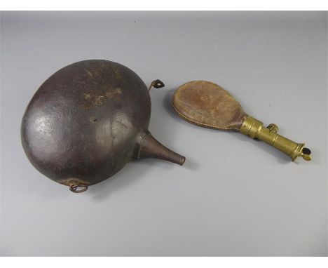 An Antique Turkish Powder Flask, with hand-stitching together with one other leather shot-flask. (2)