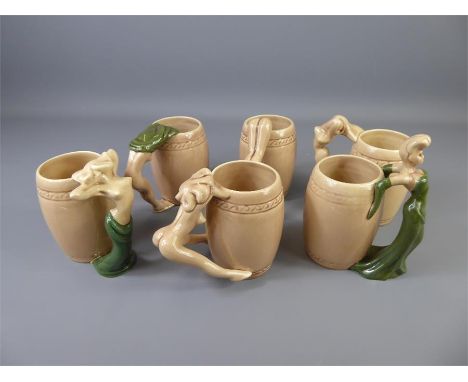 Dorothy Kindell American (1909-1961) A Charming Set of 1940's Ceramic Striptease Mugs, in various stages of undress.