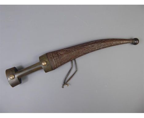 A Late 19th Century Iraqi Dagger, with damascened steel blade, approx 28 cms, contained within a lizard-skin scabbard, approx