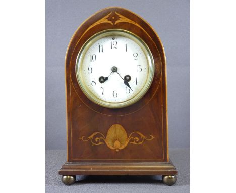 MAHOGANY MANTEL CLOCK with inlay detail on brass ball feet