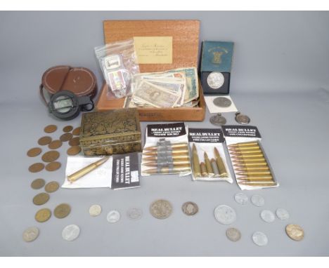 WWII MILITARY COMPASS by T G and Co Ltd, other military collectables with a quantity of British and overseas notes and coinag