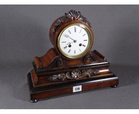 MAHOGANY MANTEL CLOCK with carved detail on four feet