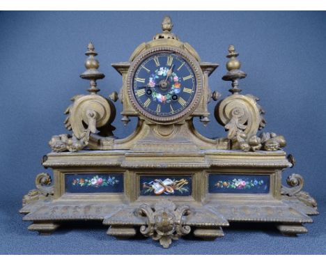 FRENCH MANTEL CLOCK with black painted dial, flanking finials and floral paint decoration