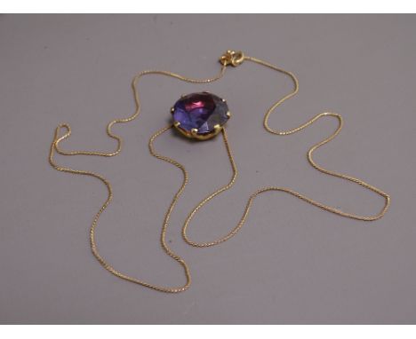 UNTESTED YELLOW METAL LARGE AMETHYST PENDANT ON 500 STAMPED NECKLACE, 28.5cms overall L, 16mm diameter stone