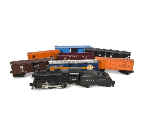 A Lionel 0 Gauge 3-rail Electric 0-4-0 ‘Switcher’ Locomotive Tender and Freight Stock, the locomotive in Lionel Lines black a