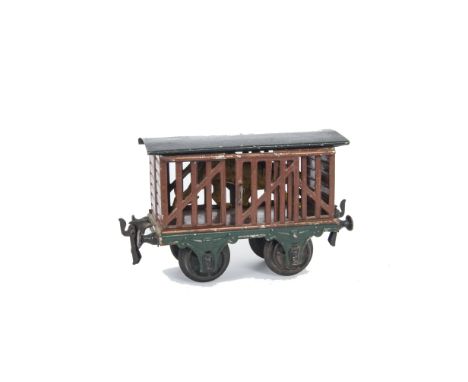 A Slightly Later Märklin Gauge I Beast Wagon, with swivelling ‘droplink’ type couplings and tinplate embossed 6-spoke wheels,
