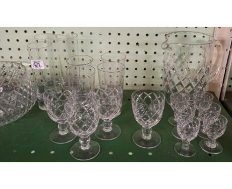 SHELF OF CUT GLASS CONSISTING OF FRUIT BOWL, JUGS ETC