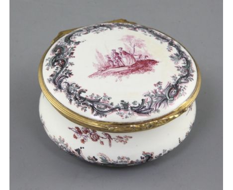 A German tin glaze circular snuff box, 18th century, the cover painted with the scene of figures and dogs in a landscape with