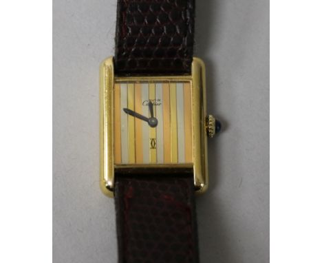 A lady's silver gilt Must de Cartier manual wind wrist watch.