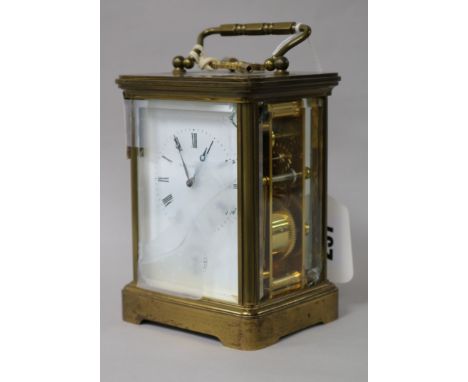 A Swiss gilt brass alarm carriage clock, retailed by Matthew Norman, London (three glass panels a.f.) H.14.5cm