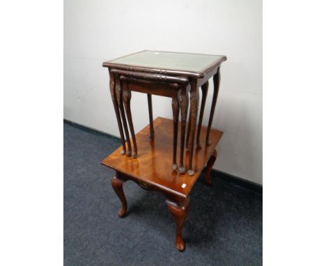 A nest of three tables with tooled leather inset panels together with a further contemporary lamp table  