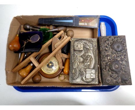 A tray of miscellany to include hand tools, wooden monkey toy, pair of yellow metal rimmed glasses, two oriental style emboss